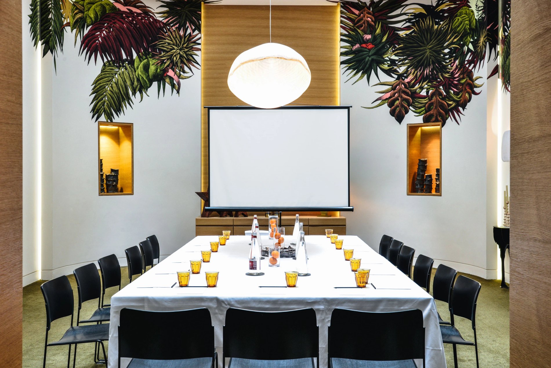 Hôtel Marignan meeting room with large set table and presentation screen