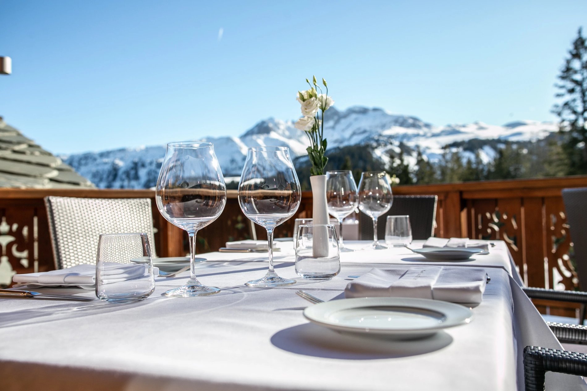 Sunny terrace at Hôtel Le Strato with panoramic mountain view