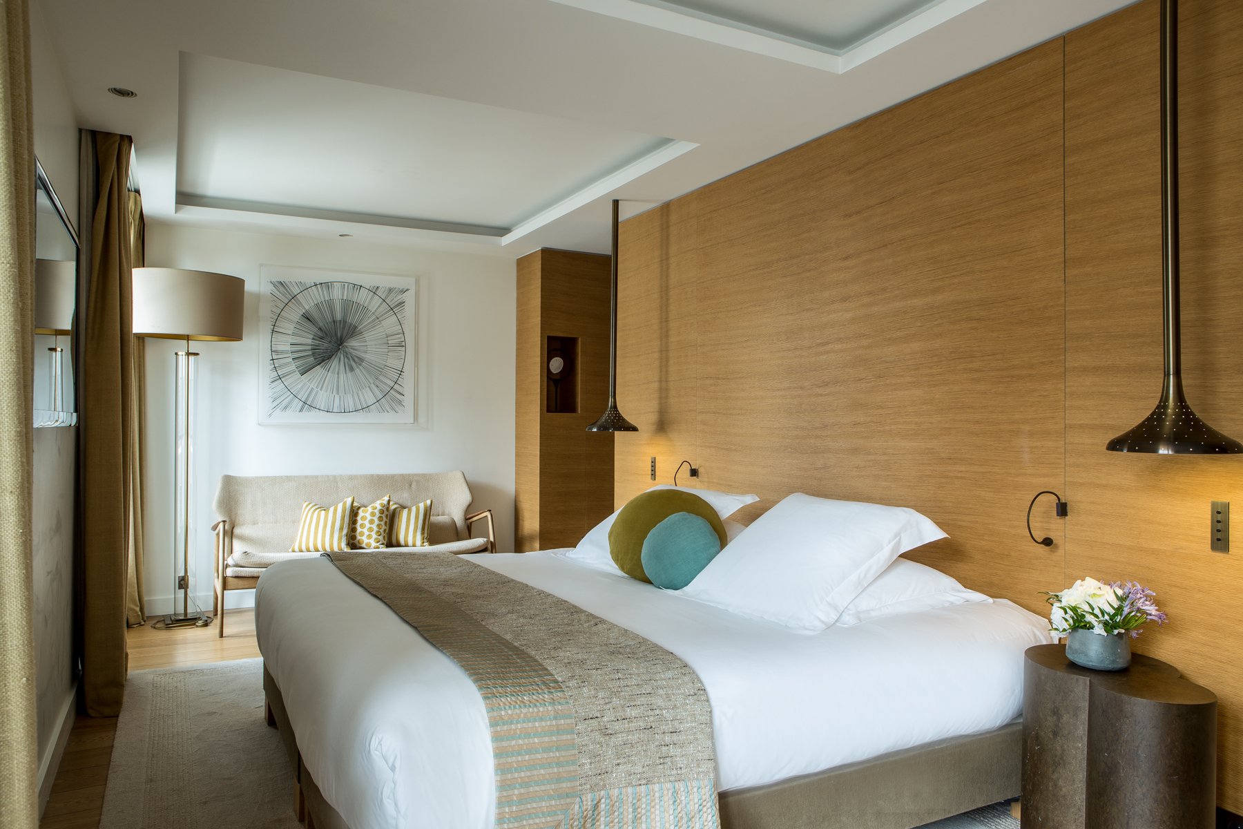 Elegant guest room at Hôtel Marignan with double bed and warm decor