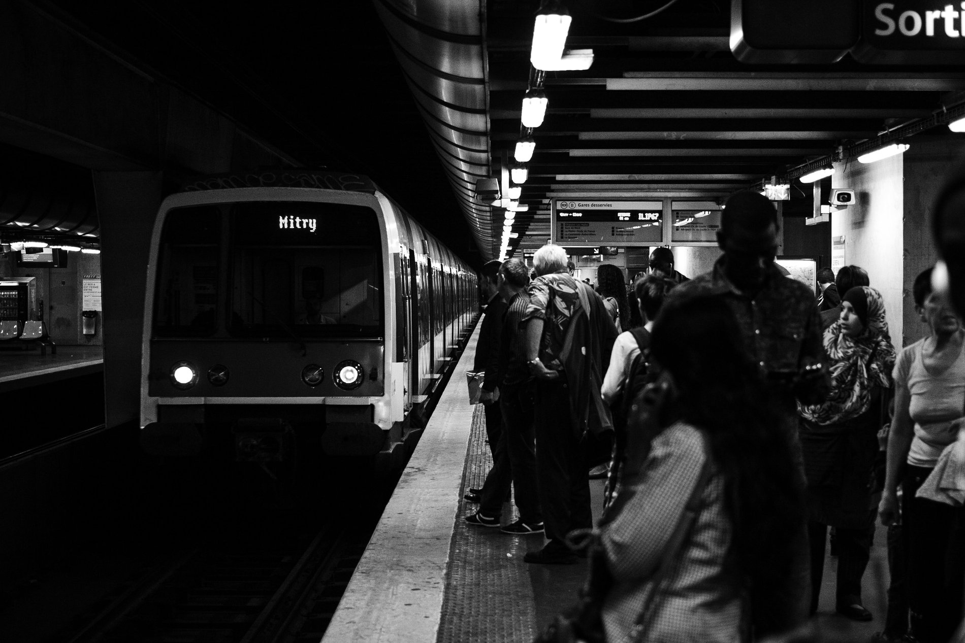 RER A platform in Paris with a train and passengers